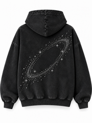 Back view of the Orbit Constellation washed black rhinestone oversized hoodie with large rhinestone orbit with scattered rhinestone stars