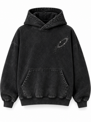 Front view of the Orbit Constellation washed black rhinestone oversized hoodie with small silver-tone rhinestone orbit on the left chest